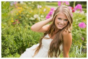 Outdoor senior girl photo session with flowers by Clarion, Iowa photographer Kristina Lynn Photography & Design