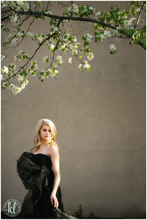 Fashion forward teen photographed in a black tulle dress.