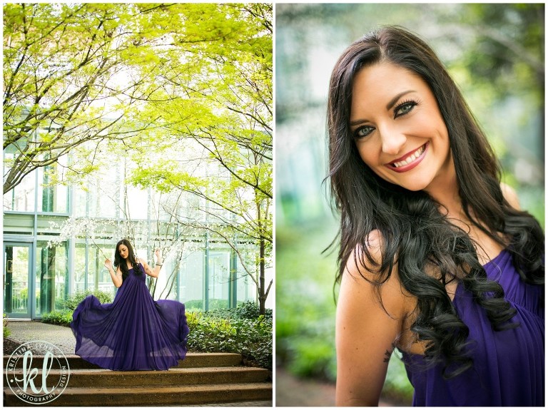 An editorial style photo of a model in a purple flowing dress in an urban garden.