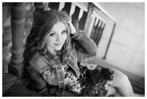 An editorial black and white image of a girl posing on the steps at Highlands Ranch Mansion in Littleton CO | Image by Kristina Lynn Photography & Design.
