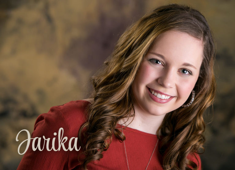 An indoor studio portrait of a high school senior girl | Image by Kristina Lynn Photography & Design.