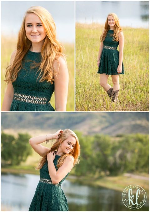 A high school senior girl wearing an emerald dress standing in a field of tall grasses.