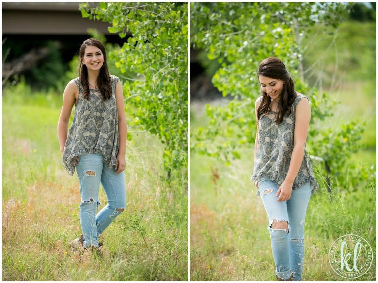 A high school teen walking through a park in torn jeans and a flowy top.
