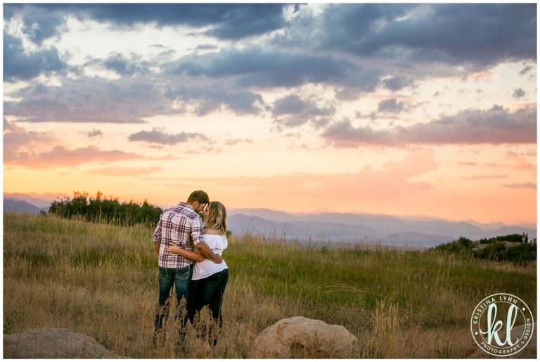 Clouds roll in at sunset to create a dramatic sky, the perfect end to this destination engagement photo shoot by Minnesota wedding photographer Kristina Lynn Photography & Design.