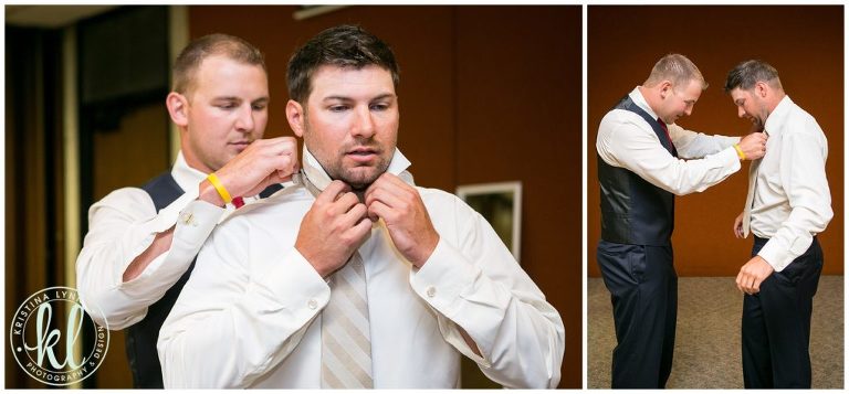The best man helps the groom get ready on his wedding day.