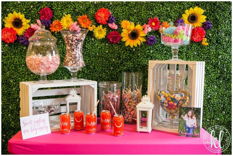 A bright and colorful graduation party theme with a custom flower backdrop. Designed by Twin Cites photographer Kristina Lynn.