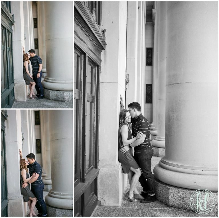 Editorial style engagement photos in front of large columns in downtown Saint Paul.