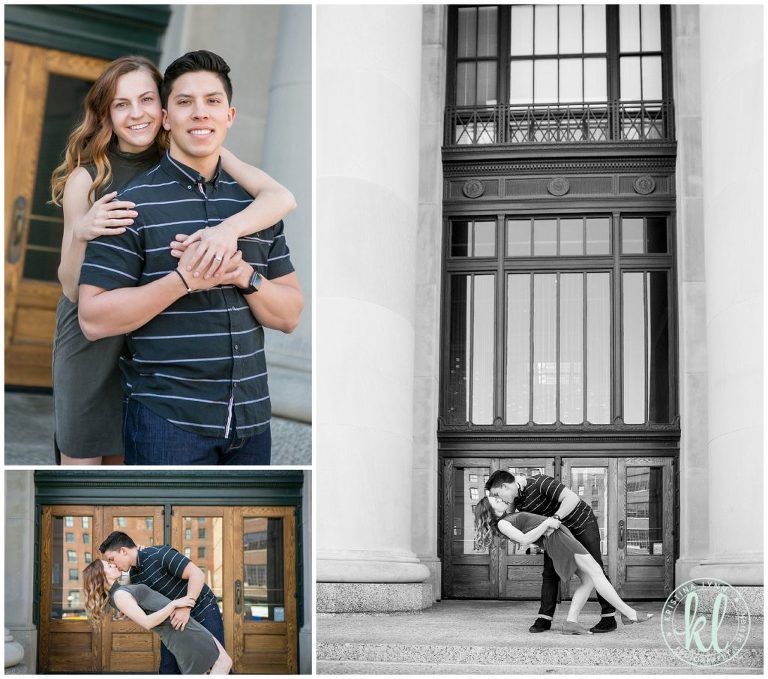 A pair dip and kiss in front of historic building in downtown.