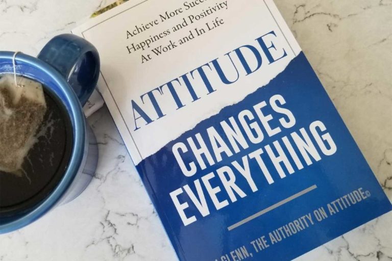 Product photography type image of a personal development book next to a cup of tea.