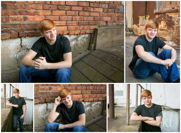 high school senior guy posing in an alleyway on main street clarion iowa