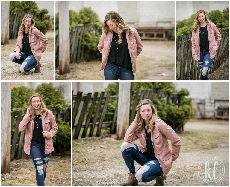 high school senior girl wearing a pink coat in an alley way