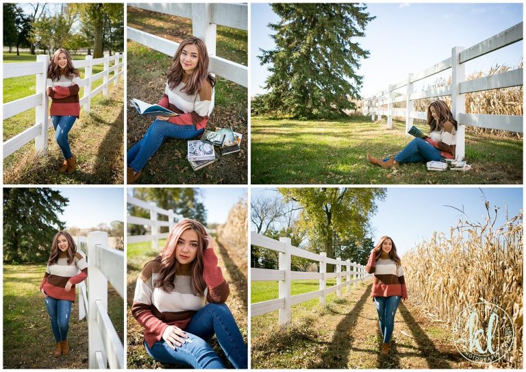 teenage girl sitting by white fence on an iowa farm