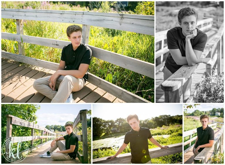 high school senior guy sitting on wooden bridge