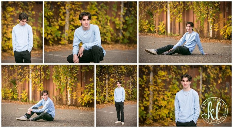 teenage guy sitting in front of rusty tin wall for senior photos in downtown stillwater minnesota
