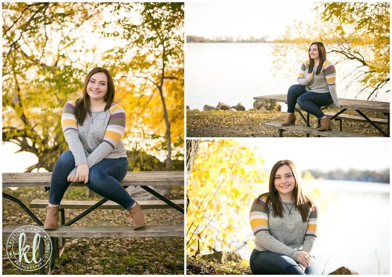 teenage girl sitting on picnic table at lake cornelia park for senior photo session