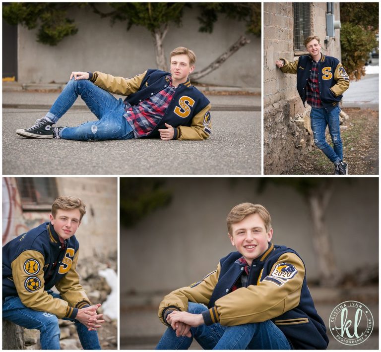 teen guy posing in alleyway for graduation pictures downtown stillwater minnesota
