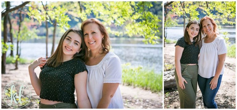 high school senior and mom pose for a photo along st croix river near stillwater minnesota