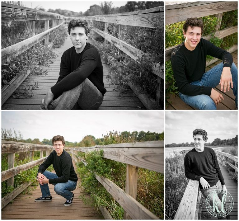 high school senior guy poses on wooden bridge at lake mckusick in stillwater minnesota