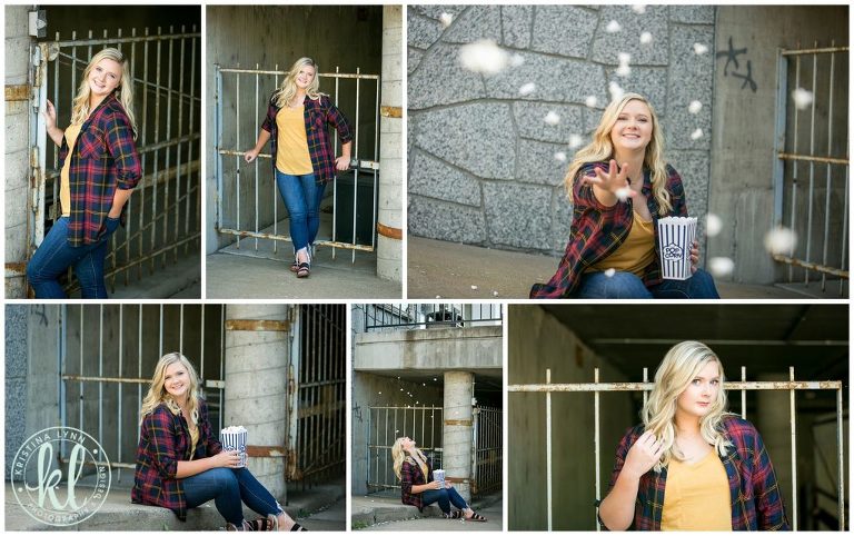 high school senior girl poses for senior pictures outside parking garage in downtown stillwater minnesota