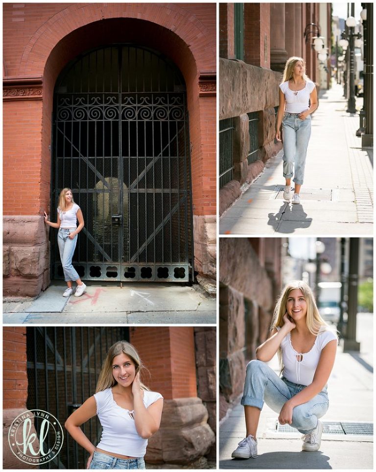 teenage girl poses for senior photos in downtown st paul minnesota