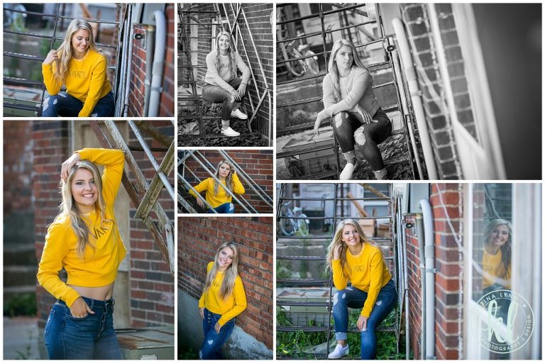 high school senior girl sitting on metal stairs in an alleyway