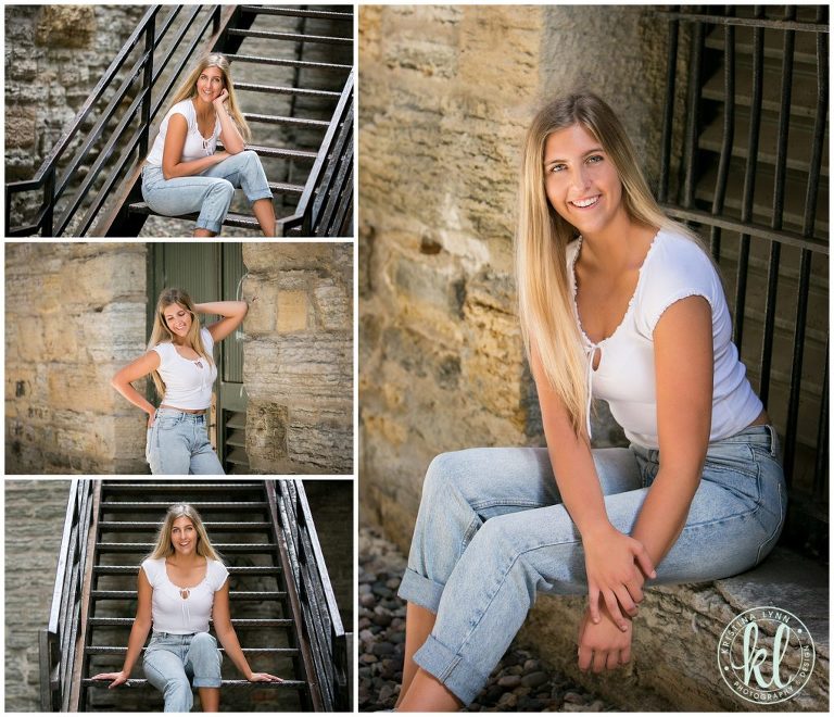 teenage girl sitting on metal stairs in an alley in downtown st paul minnesota